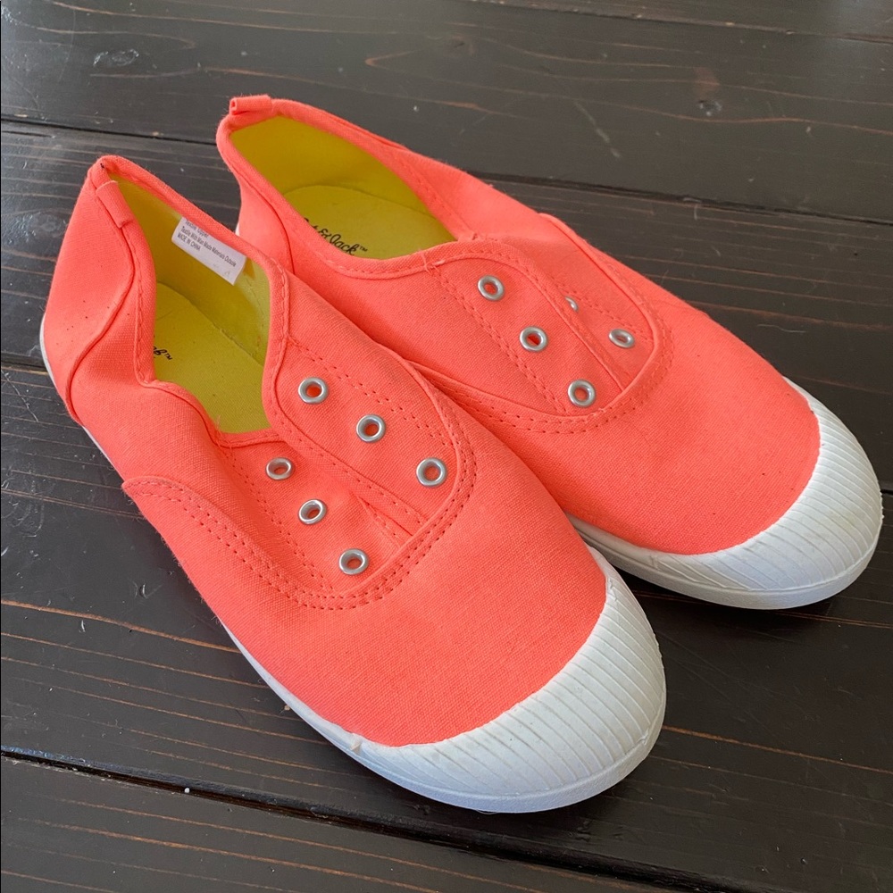 Orange slip ons